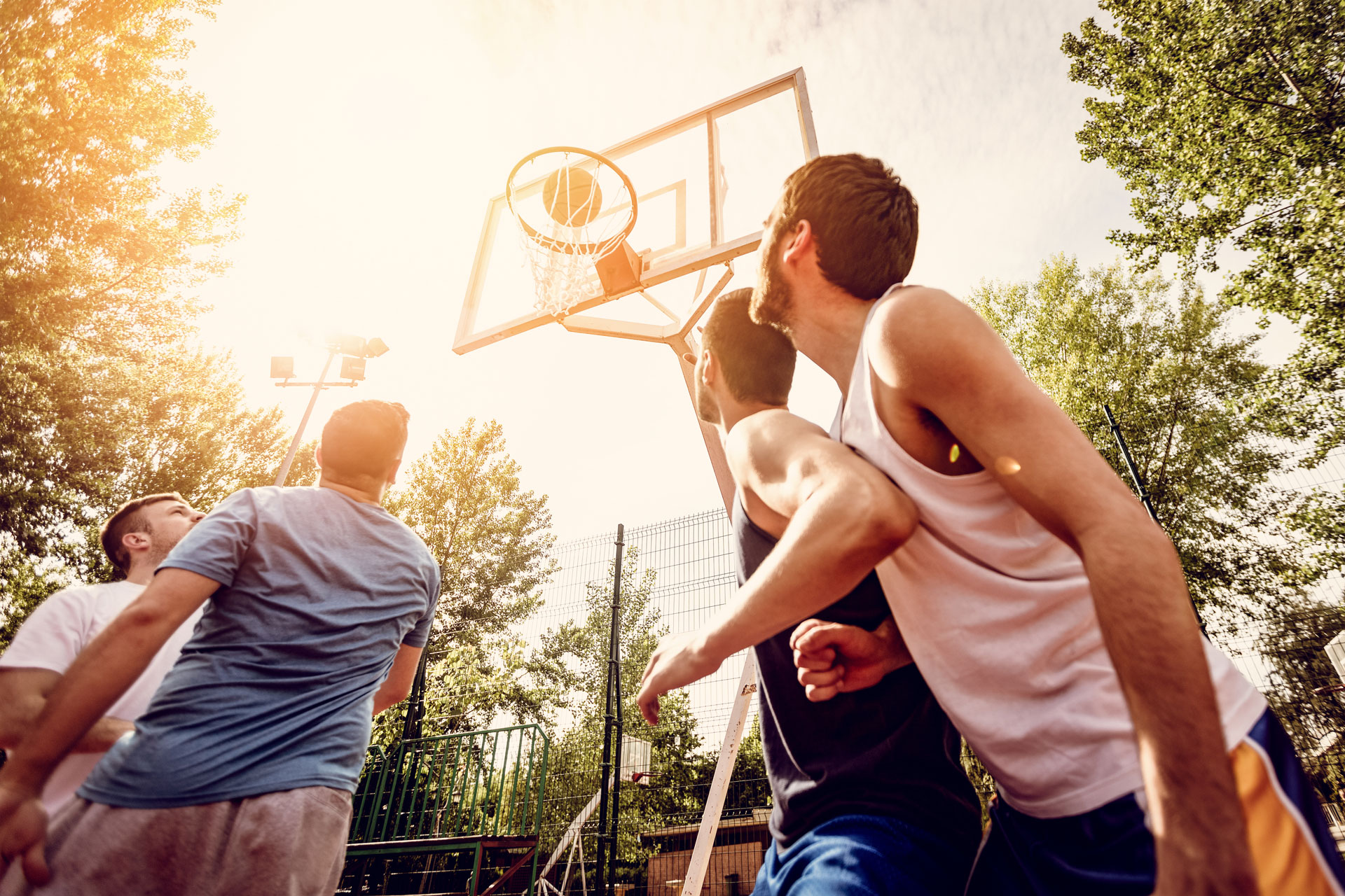 Вместе действие. Playing Basketball outside. They are playing Basketball. Basketball Players outside. Entertainment playing Basketball outside.